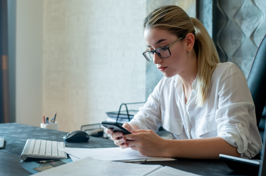 Economic downturn search behavior shown as a professional checks information and finances.