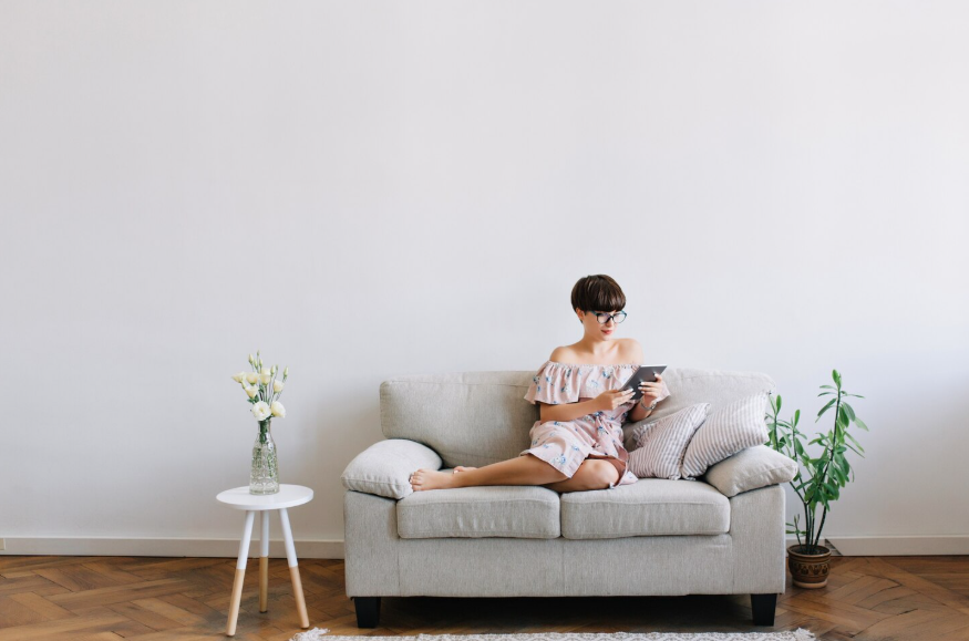 Person relaxing in a minimalist home reflecting intent behind minimalist living searches.