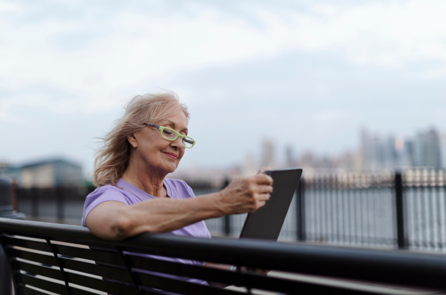 Search habits as we age shown through calm, confident senior woman using phone.